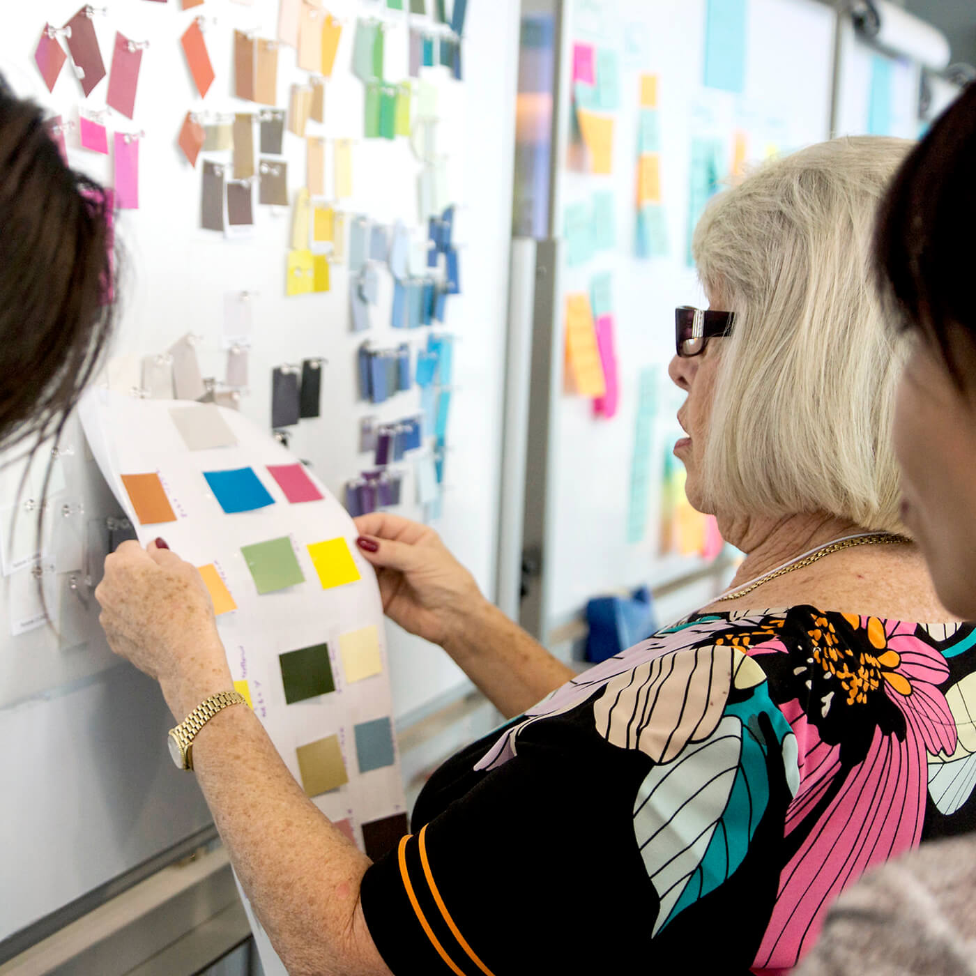 Color forecasters collaborating to predict color trends.