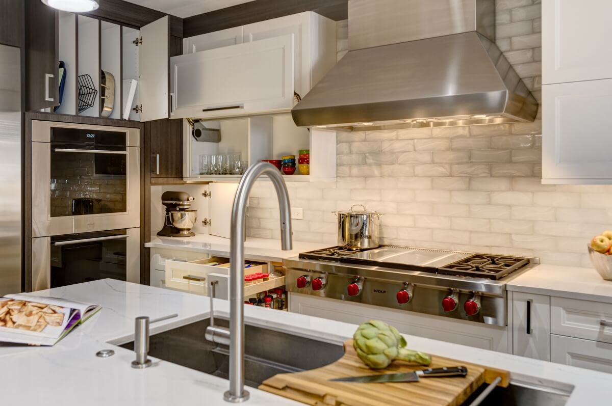 View of Dura Supreme storage solutions, Pull-Out Spice cabinet, Tray Dividers, Lift Door cabinet.