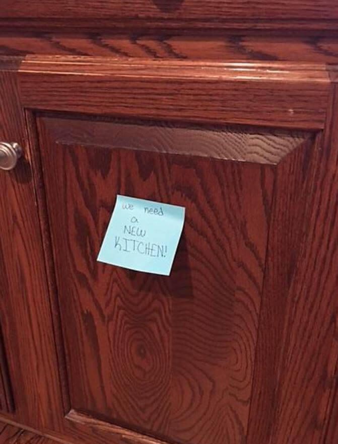 A Post-It note written by a member of the family attached this to one of the existing cabinet doors. This particular cabinet door kept falling off its hinges!