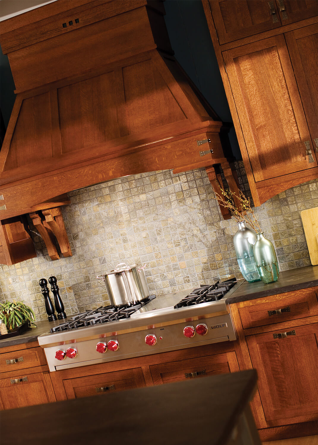 Wood hoods add a true hand-crafted focal point to a Craftsman style kitchen design.