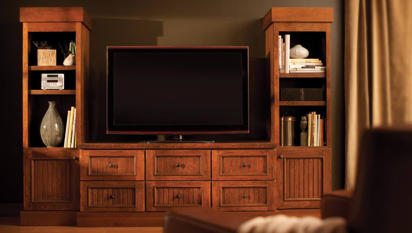A crafsman styled entertainment center and TV stand.