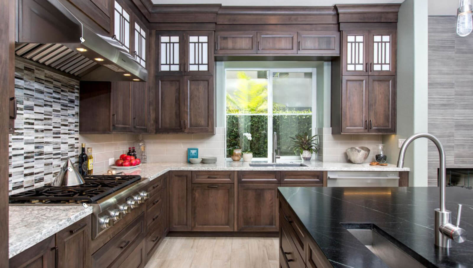 A modern Craftsman kitchen design with sleek mullion cabinet doors inspired by Arts & Crafts styling.