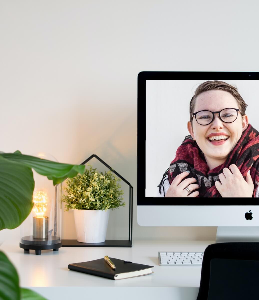 Video conferencing is changing home office interior design. A beautiful home office desk with a video meeting in progress.