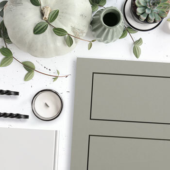 Inset cabinets with a sage green paint color from Dura Supreme's Framed Crestwood Cabinetry product line.