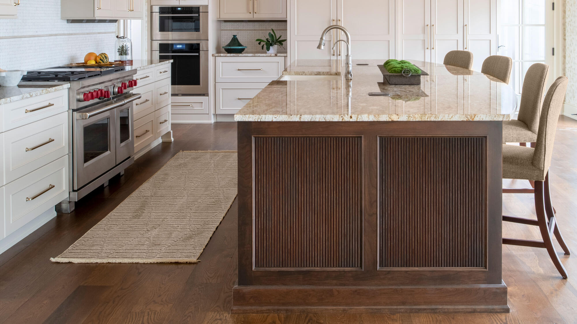 Reeded panels at the end of a kitchen island.