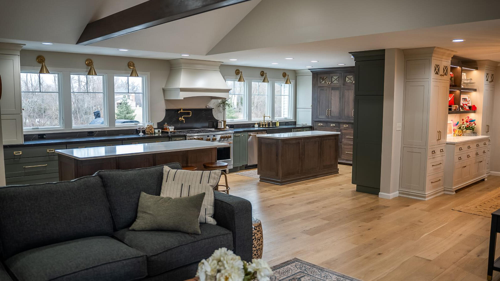 A beautiful kitchen remodel with 3 colors of cabinet finishes and two kitchen islands.