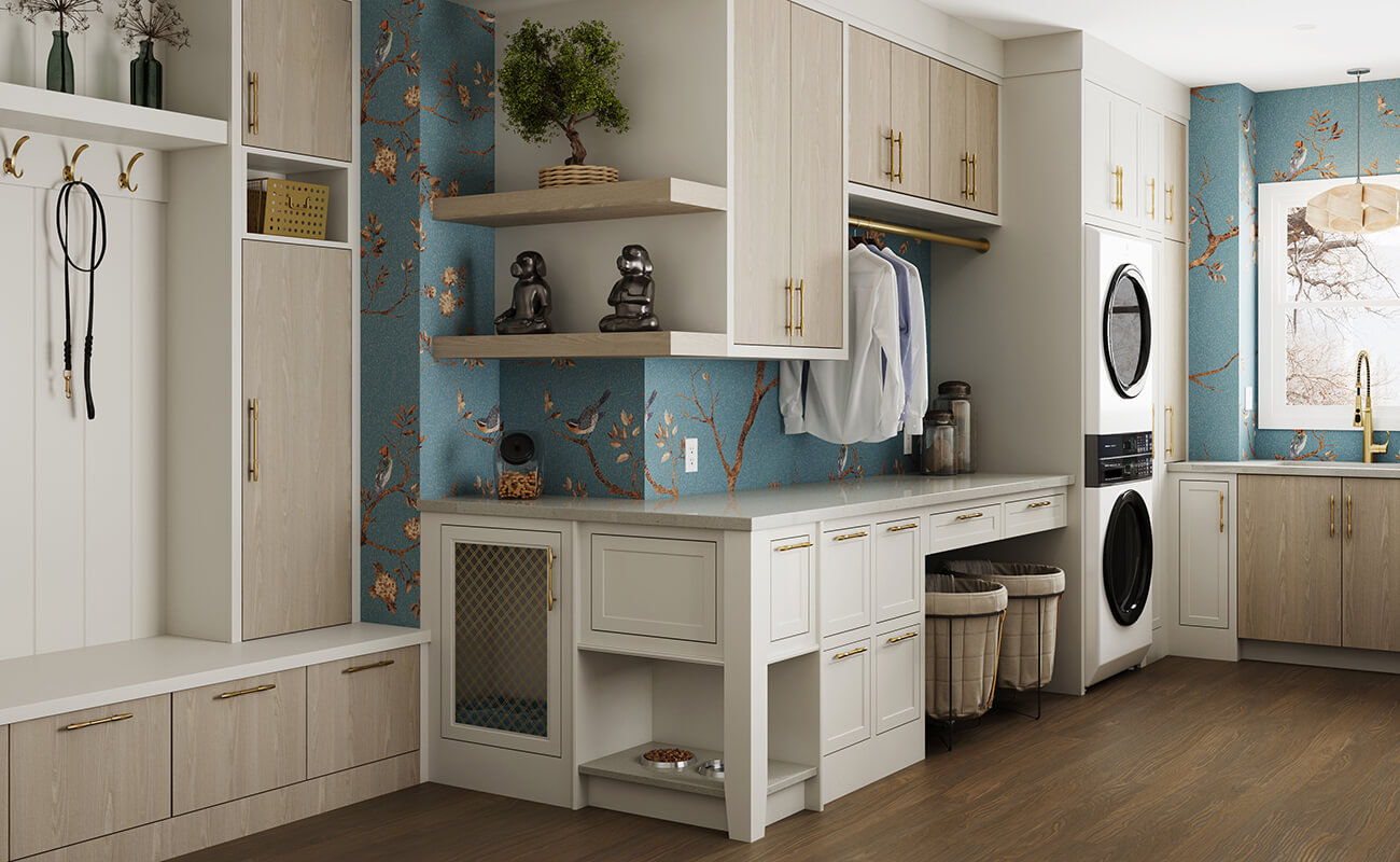 A beautiful laundry room and mudroom designed with the pets in mind. A dog dish cabinet and a kennel cabinet are integrated into the space.