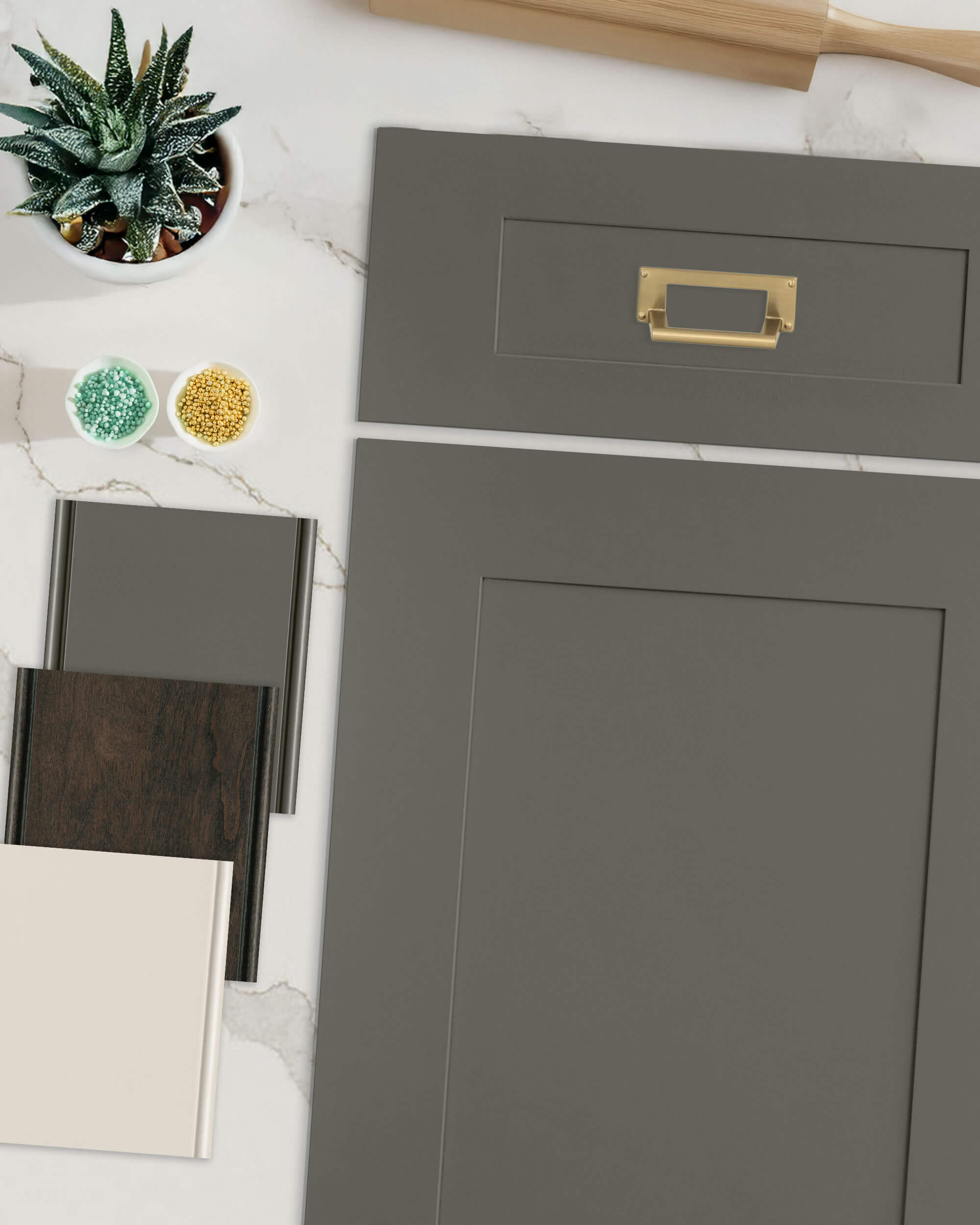 A flat lay photo showing the mood board idea for this kitchen remodel with a green painted shaker cabinet door paired with a dark stained wood, and muted white paint color.