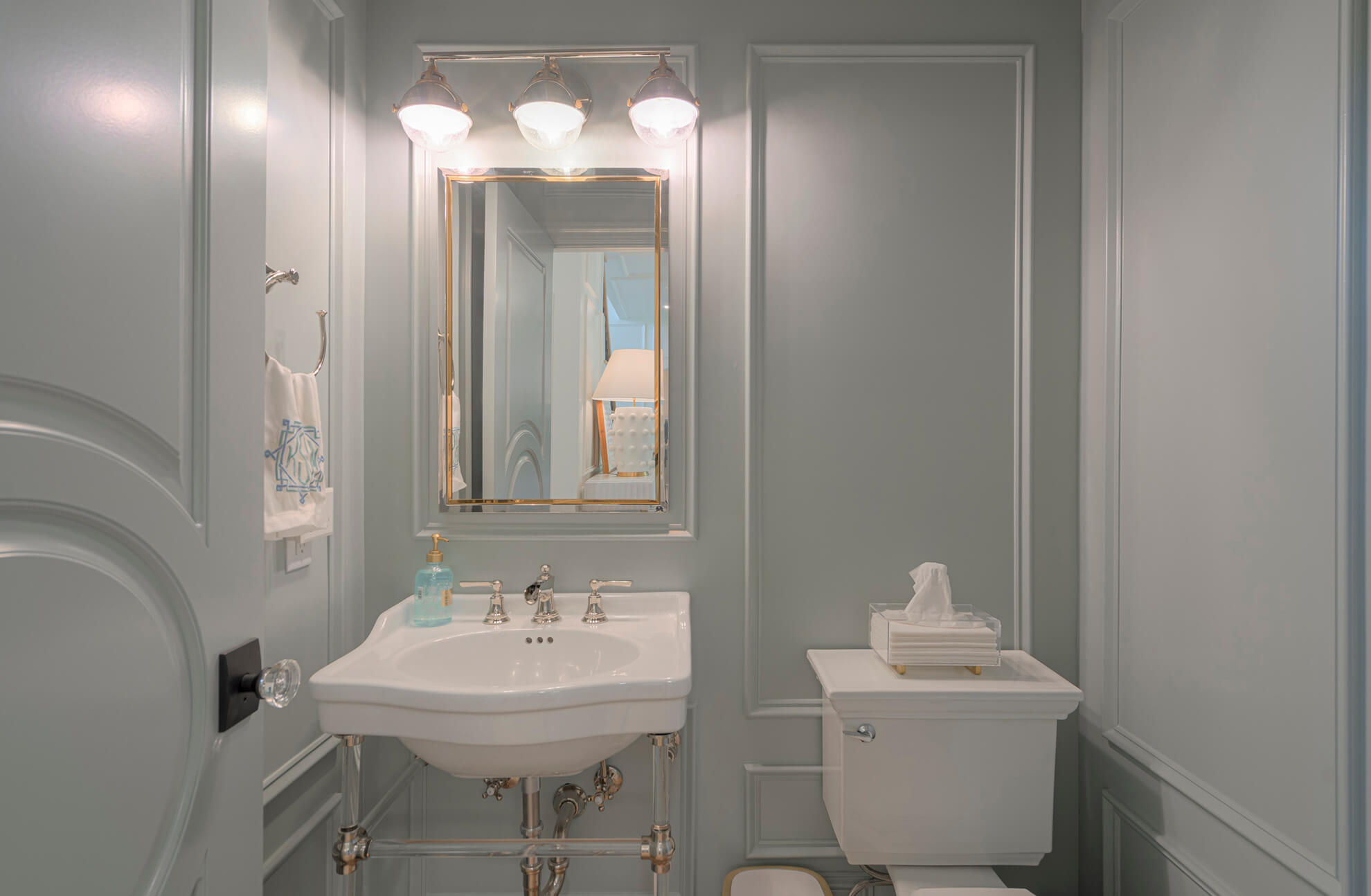 A color drenched bathroom with a light neutral blue-gray hue makes for a calm and peaceful interior design.