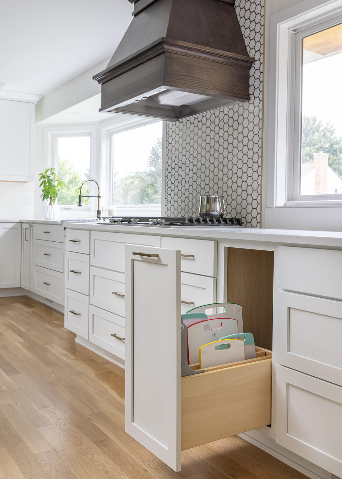 A Base Pull-Out Tray Divider Cabinet from Dura Supreme offers practical and convenient use of space and works great for storing a larger collection of cutting boards, trays, baking sheets, pans, etc.